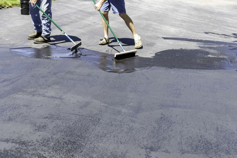 Professional Asphalt Sealers at Work